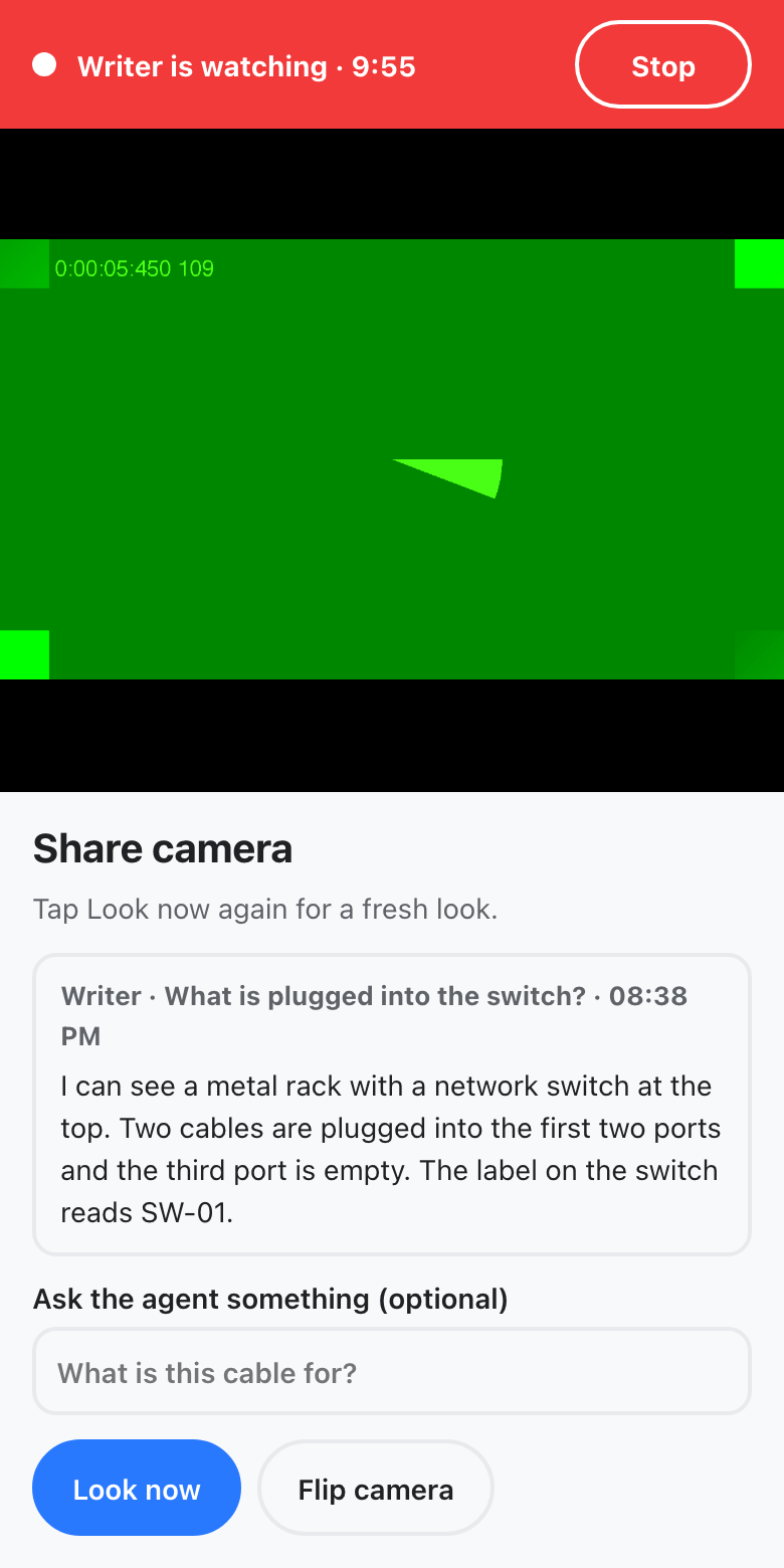 The phone showing the camera to an agent, with the agent's answer under the picture